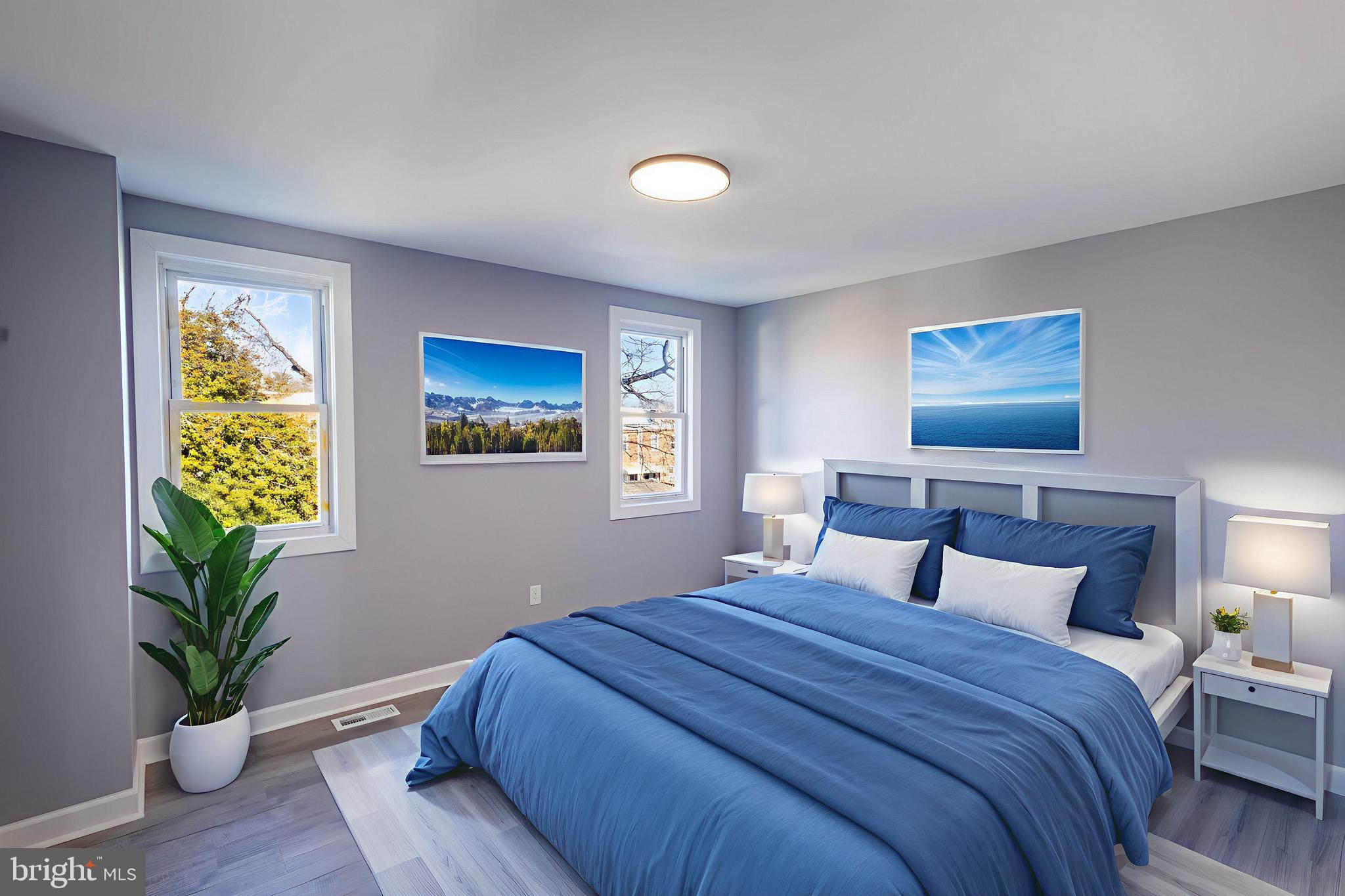 619 Aldershot Road Baltimore, MD 21229 - Photo 21 of 29 a bedroom with bed and painting on the wall