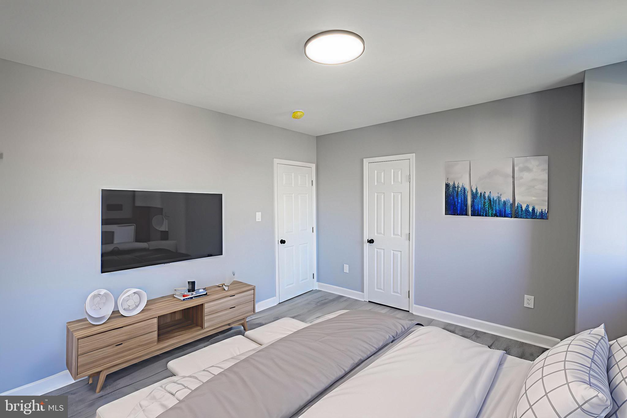 619 Aldershot Road Baltimore, MD 21229 - Photo 23 of 29 a bedroom with furniture and a flat screen tv