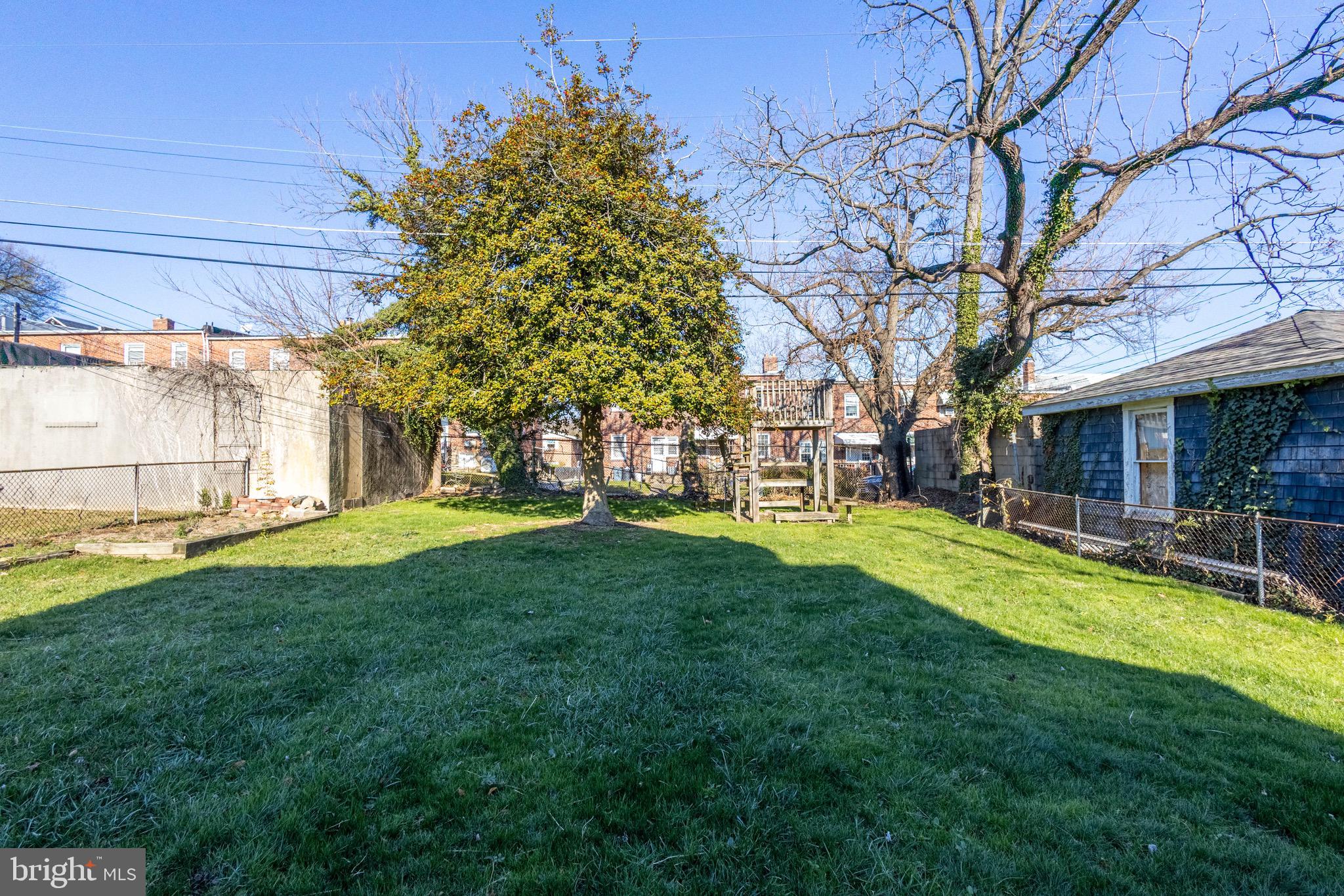 619 Aldershot Road Baltimore, MD 21229 - Photo 29 of 29 a view of a house with a yard