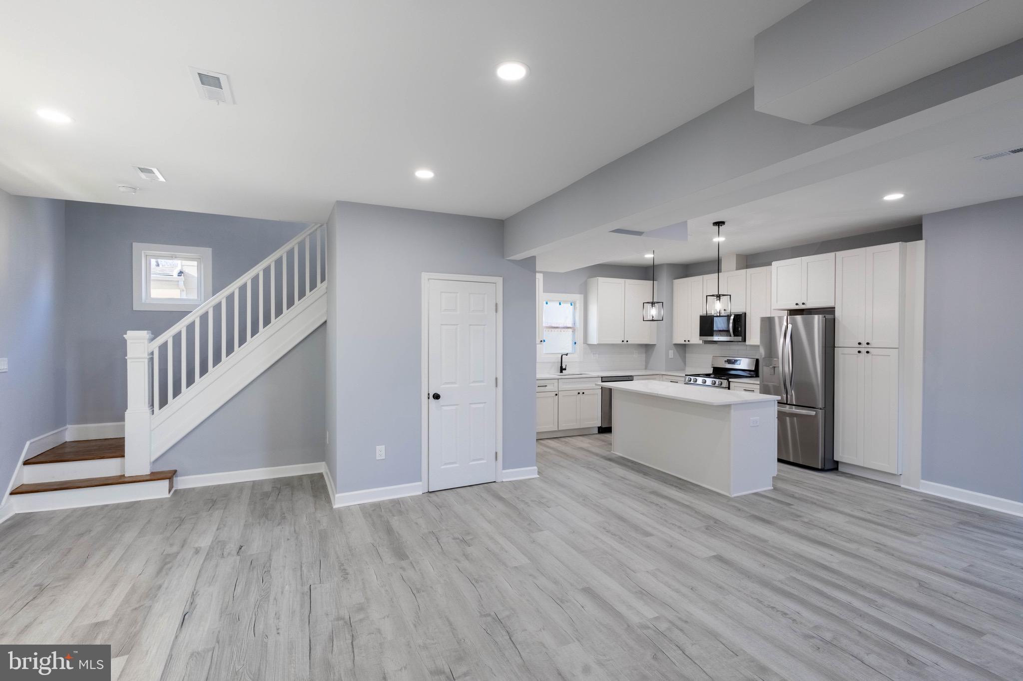 619 Aldershot Road Baltimore, MD 21229 - Photo 5 of 29 a view of kitchen with wooden floor and electronic appliances