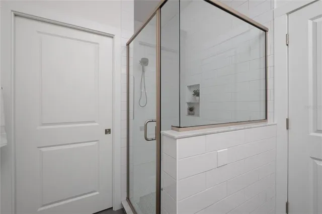 a bathroom with a sink toilet and a mirror
