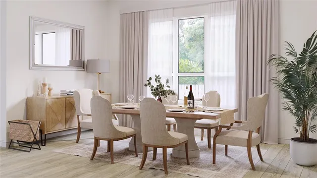 a living room with furniture a flat screen tv and a large window