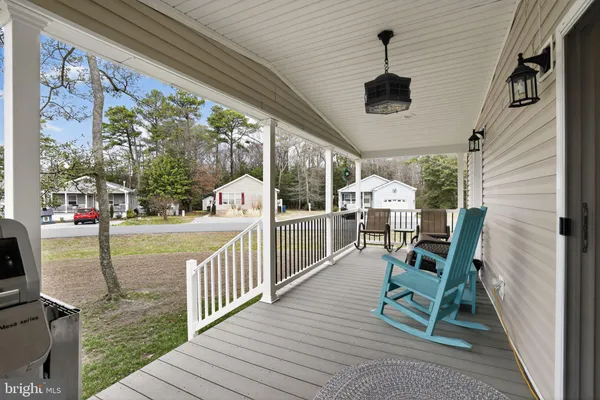 a view of a chairs and table in the balcony