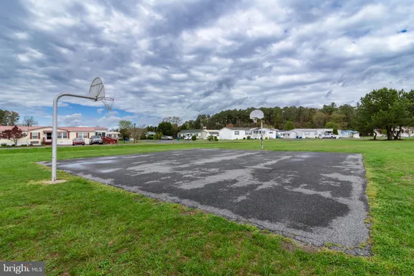 a view of a playground with a yard