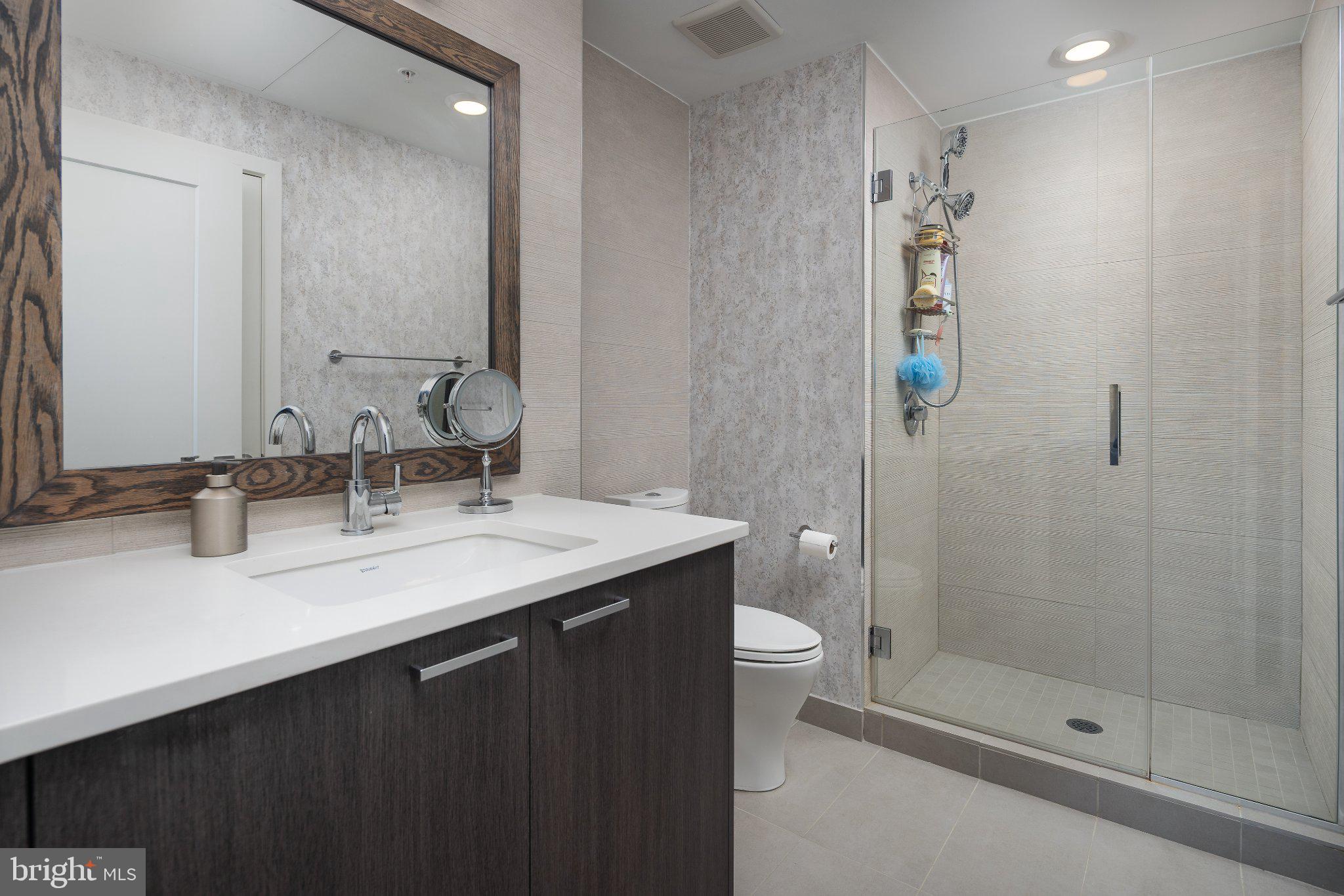 525 Southwest Water Street Southwest, Unit 404 Washington, DC 20024 - Photo 18 of 82 Sleek modern bathroom oasis.