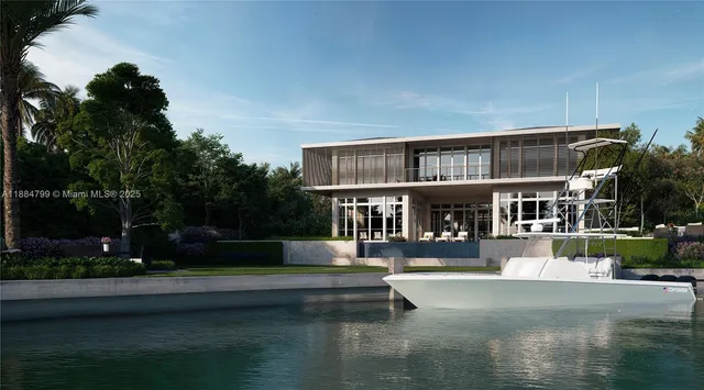 a view of a white house in a big yard with large trees