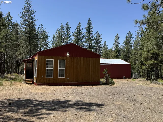 a house with trees in the background