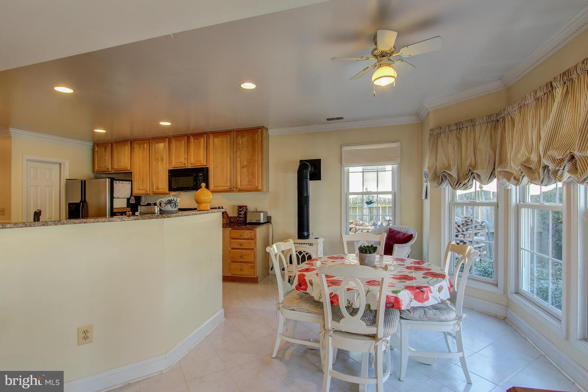 701 Ritchie Avenue Silver Spring, MD 20910 - Photo 9 of 30 Breakfast area w/ woodstove