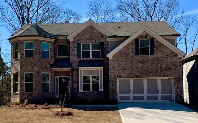 1600 Silver Crest Way Hoschton, GA 30548 - Photo 1 of 1 a front view of a house with a garden