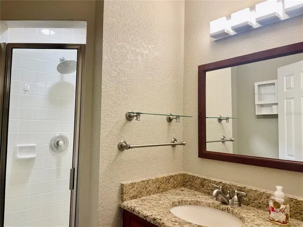 a bathroom with a sink and a mirror