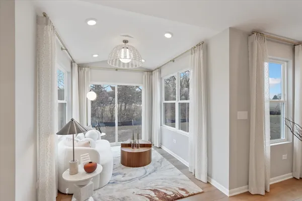 a dining room with furniture and window