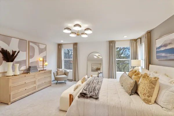 a bedroom with a large bed and a large window