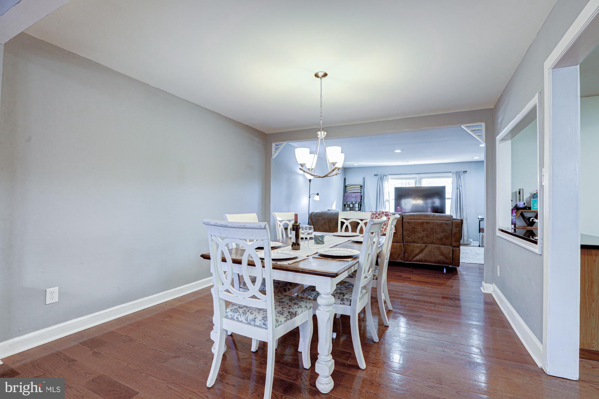 15 Evergreen Drive Newark, DE 19702 - Photo 21 of 85 a view of a dining room with furniture and wooden floor