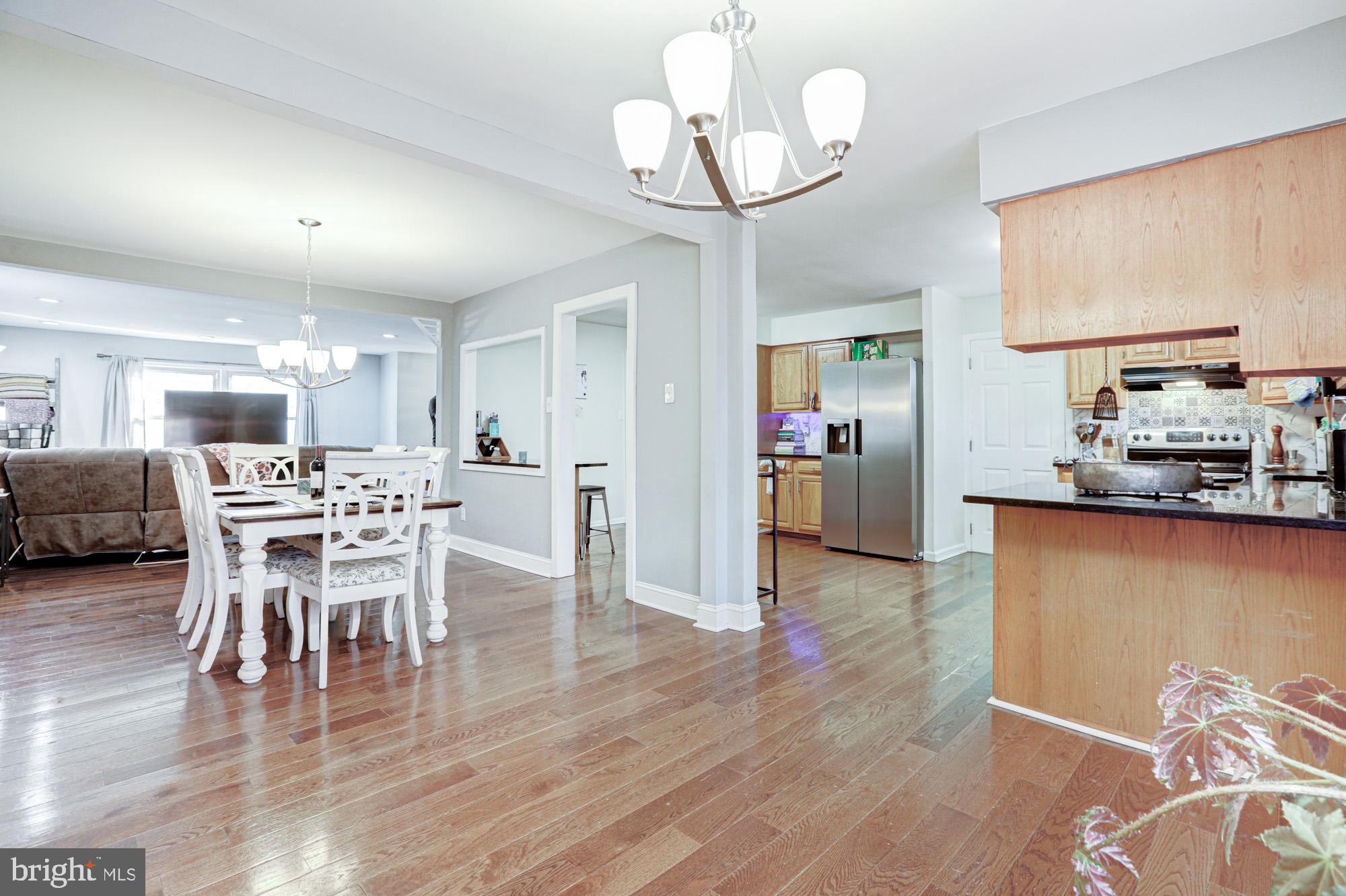 15 Evergreen Drive Newark, DE 19702 - Photo 22 of 85 a view of a dining room with furniture and wooden floor
