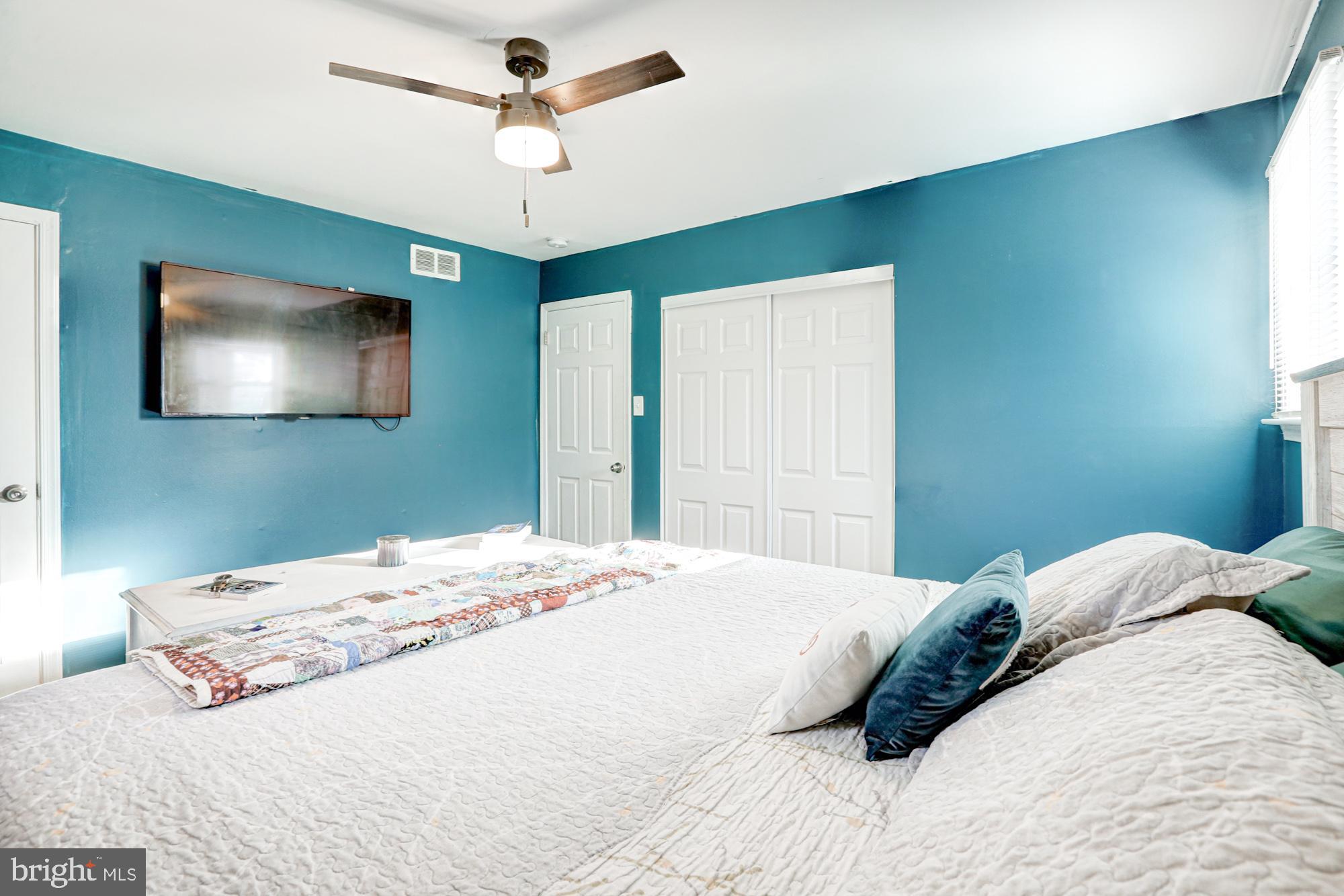 15 Evergreen Drive Newark, DE 19702 - Photo 38 of 85 a bedroom with a bed and a flat screen tv