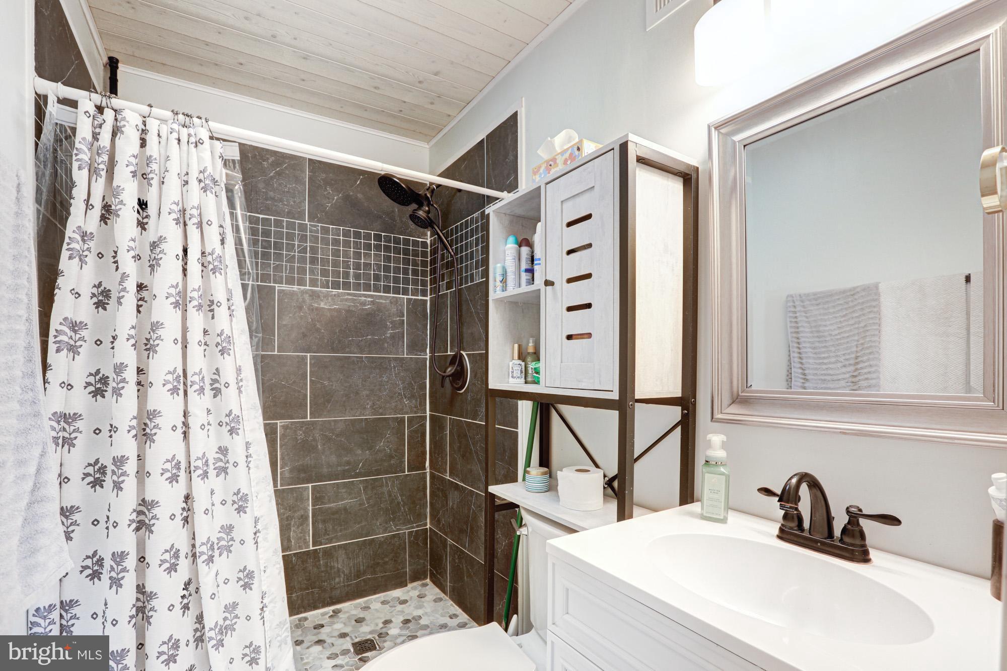 15 Evergreen Drive Newark, DE 19702 - Photo 40 of 85 a bathroom with a sink toilet and shower