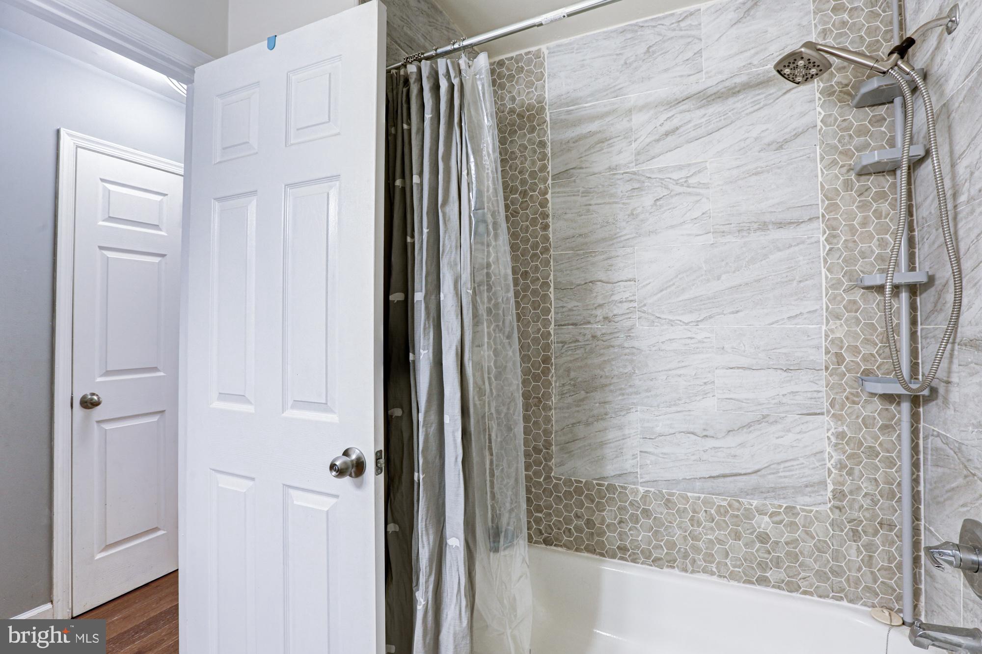 15 Evergreen Drive Newark, DE 19702 - Photo 47 of 85 a bathroom with a shower and a tub
