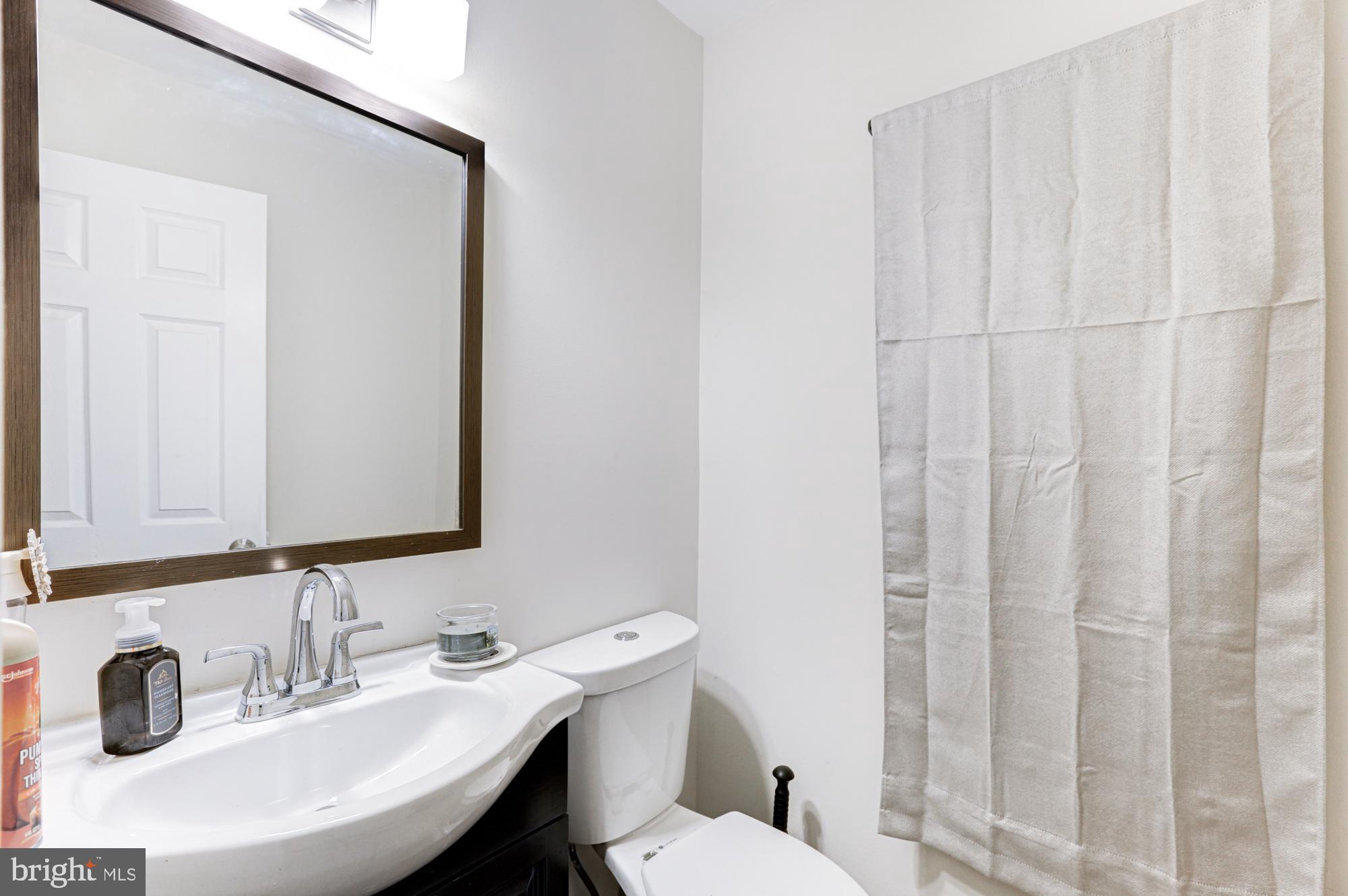 15 Evergreen Drive Newark, DE 19702 - Photo 51 of 85 a bathroom with a sink and a toilet