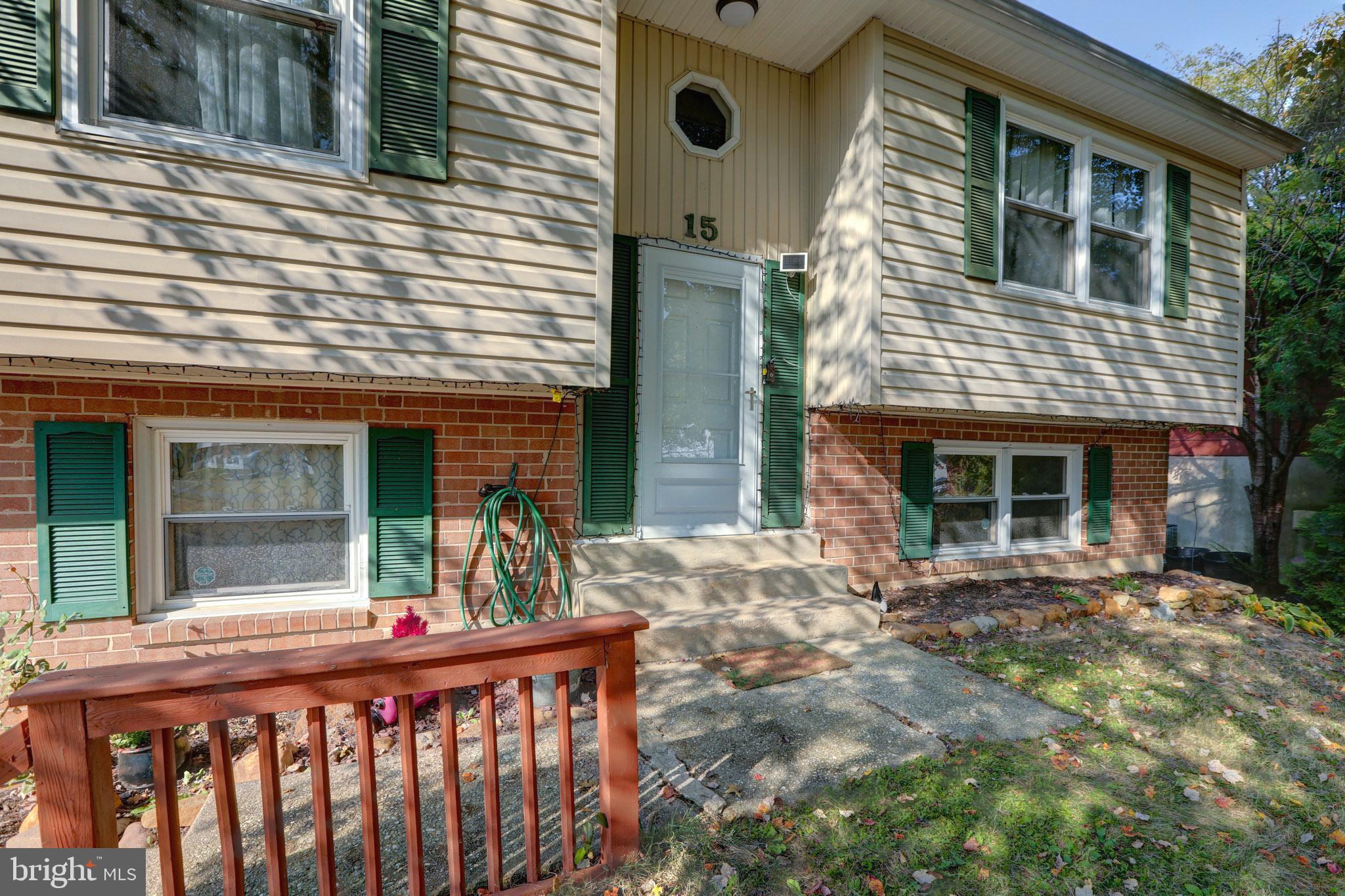 15 Evergreen Drive Newark, DE 19702 - Photo 9 of 85 a view of a house with large windows and a small yard