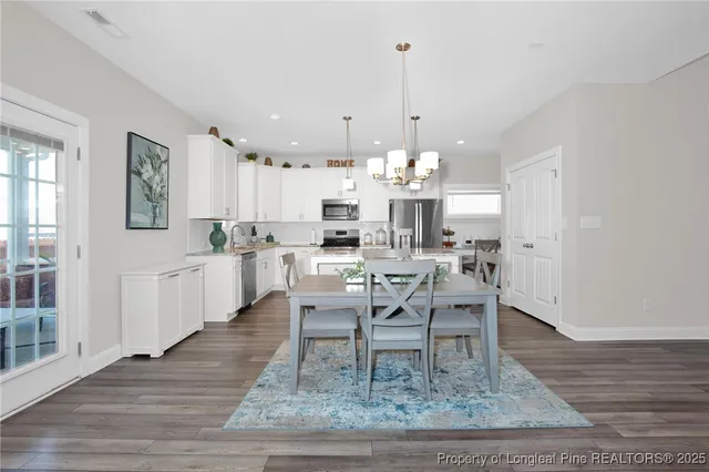 a view of a dining room with furniture
