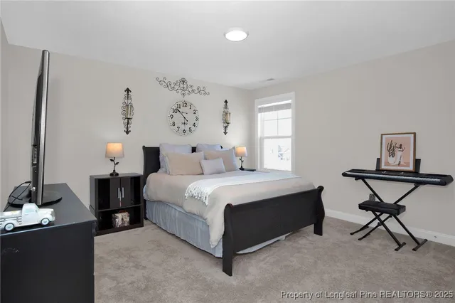 a bedroom with a bed and a table in it