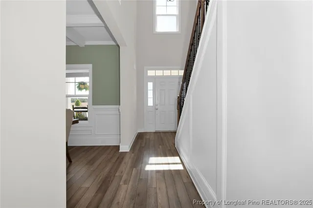 a view of a hallway view with wooden floor