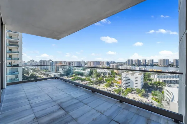 a view of a terrace with outdoor seating and city view