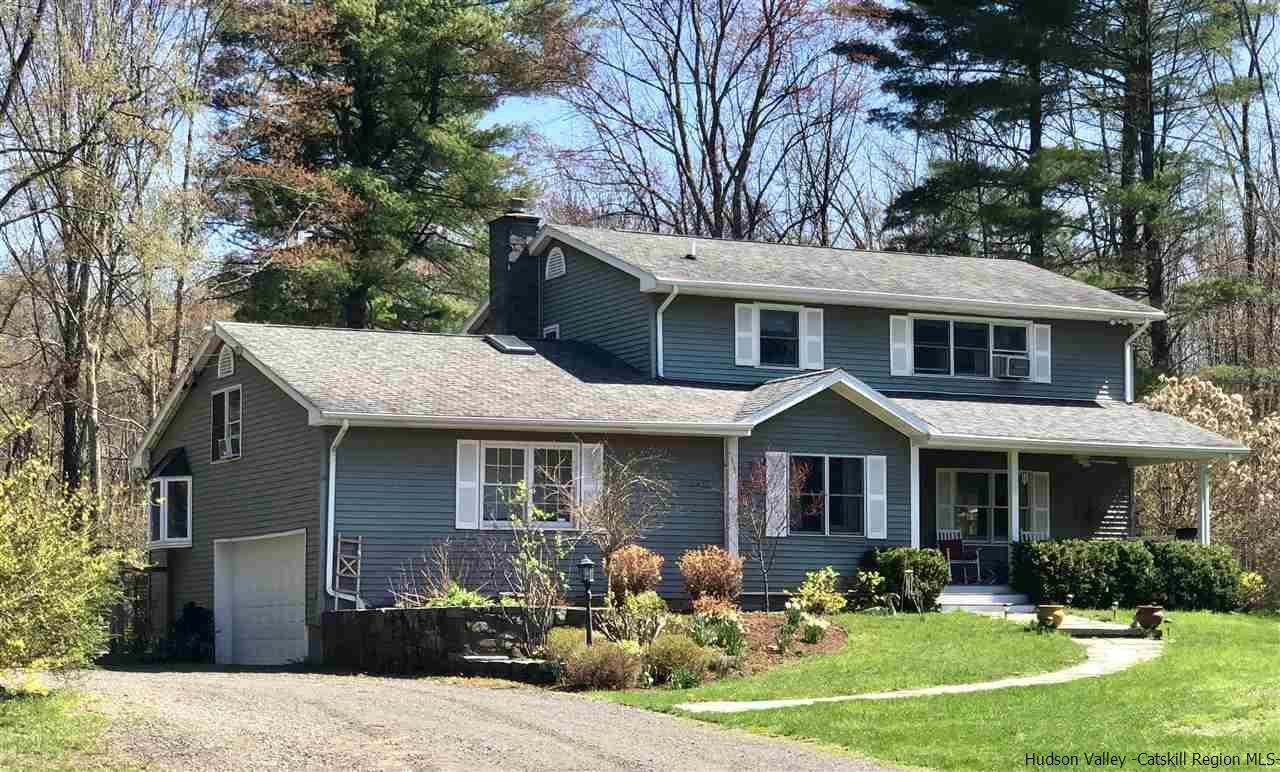 52 Buck Road Stone Ridge, NY 12484 - Photo 1 of 35 a front view of a house with a yard garden and outdoor seating