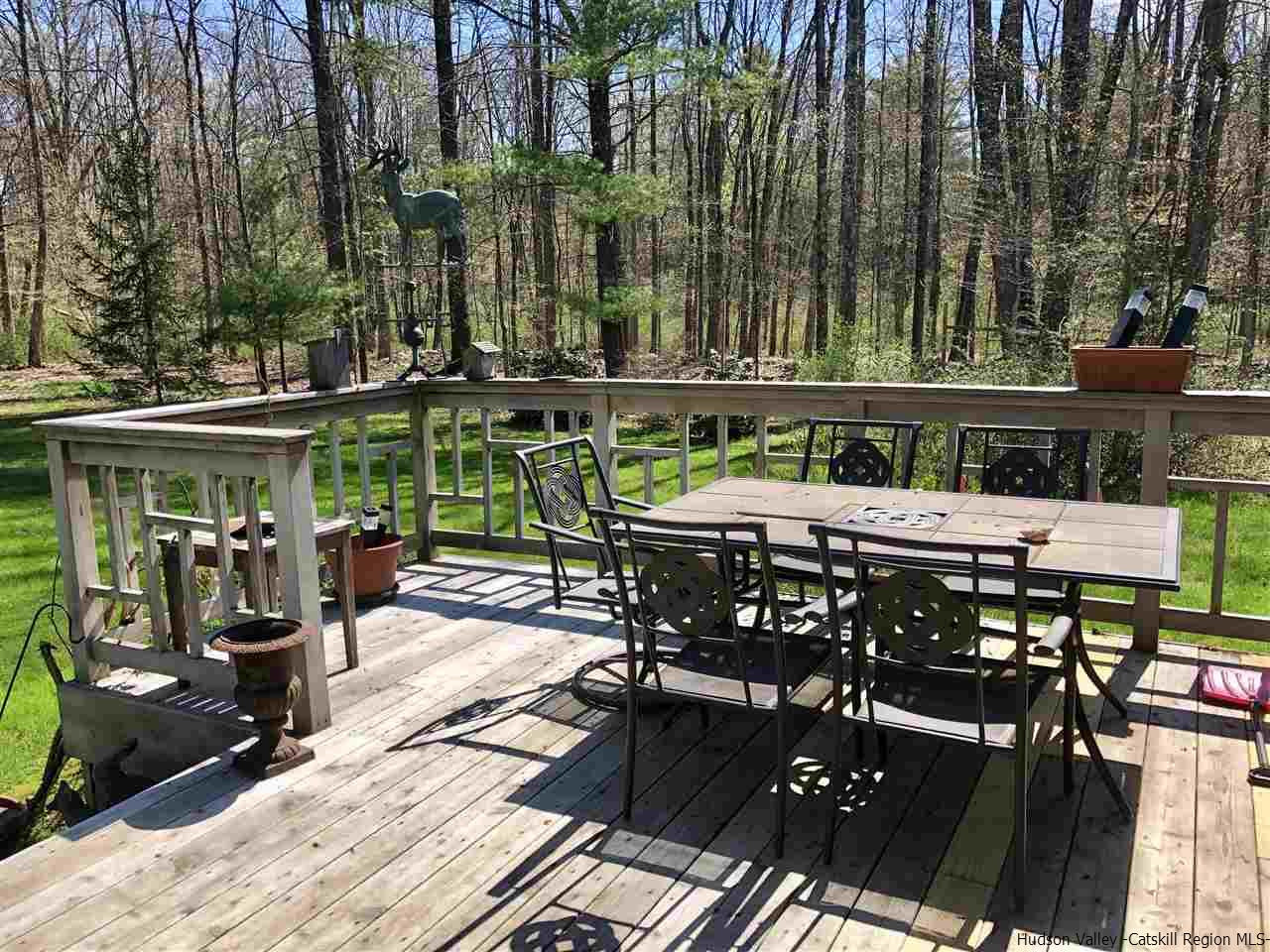 52 Buck Road Stone Ridge, NY 12484 - Photo 27 of 35 a view of a dinning tables and chairs in the patio