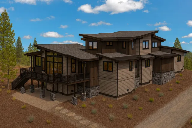 a view of a house with a wooden deck front of house