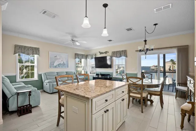a living room with furniture kitchen view and a dining table