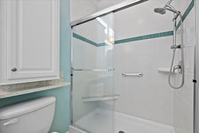 an aerial view of a city with swimming pool and lawn chairs