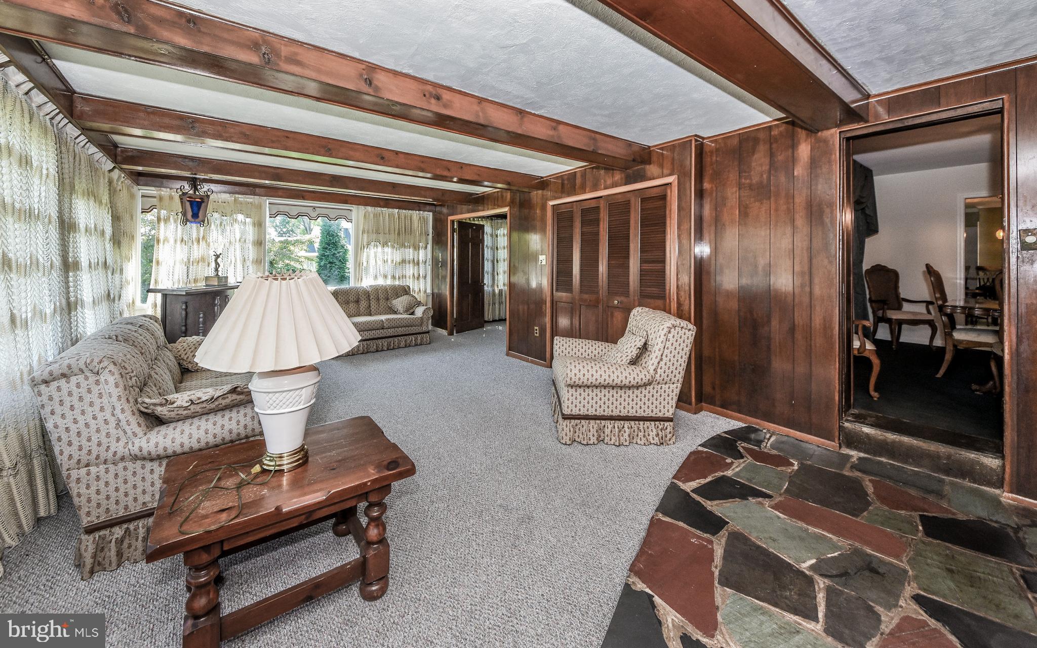 2083 Williamsburg Road Huntingdon Valley, PA 19006 - Photo 11 of 46 a living room with furniture and a chandelier