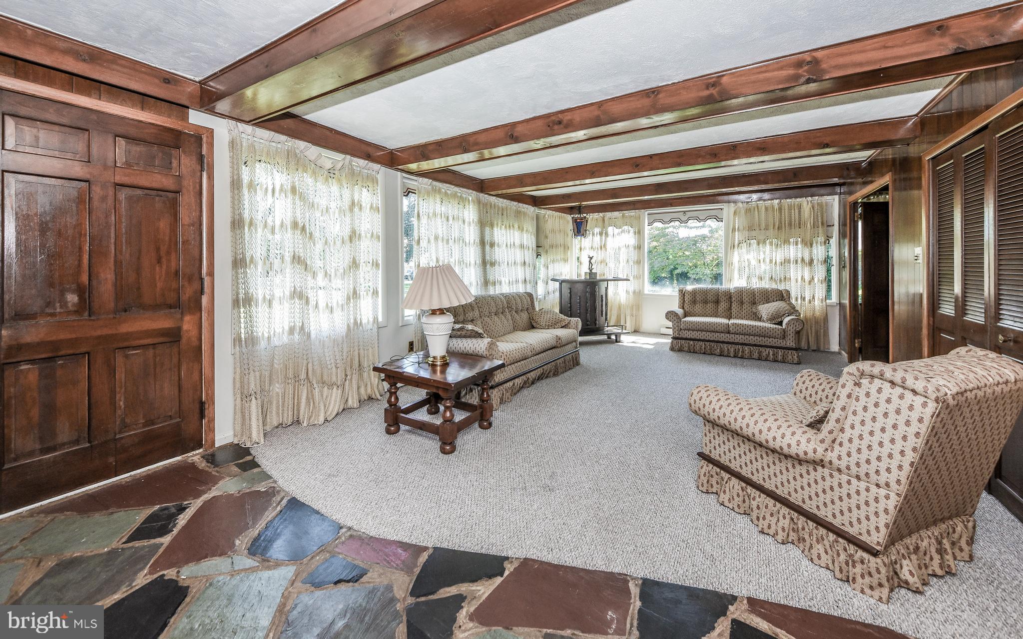 2083 Williamsburg Road Huntingdon Valley, PA 19006 - Photo 12 of 46 a living room with furniture and a large window