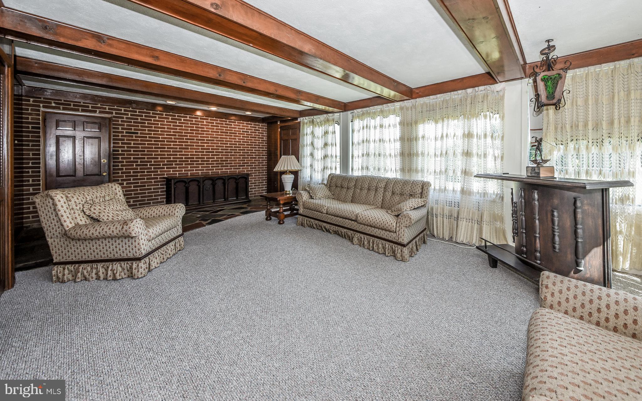 2083 Williamsburg Road Huntingdon Valley, PA 19006 - Photo 13 of 46 a living room with furniture and a fireplace