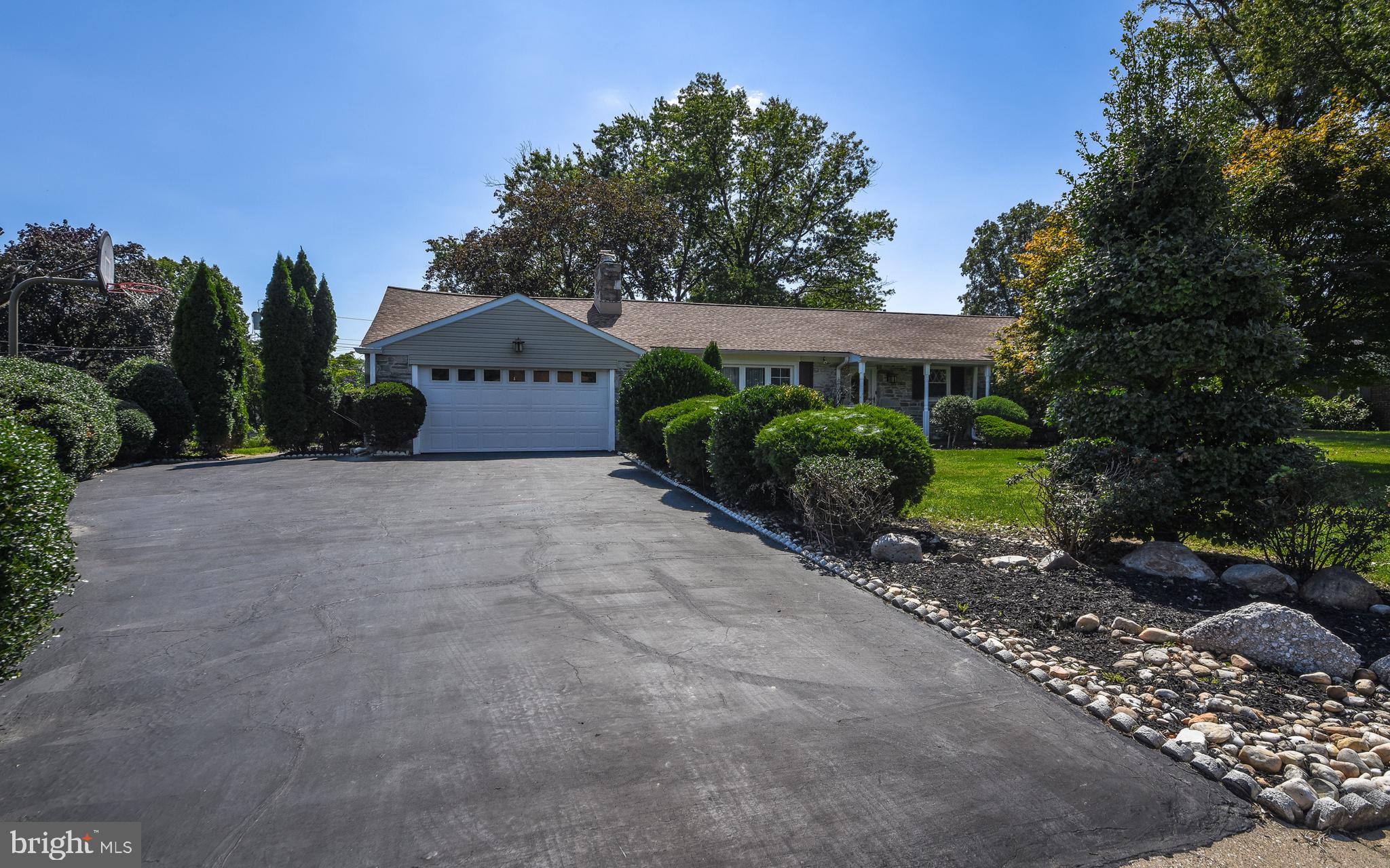 2083 Williamsburg Road Huntingdon Valley, PA 19006 - Photo 3 of 46 a front view of a house with a yard and garage