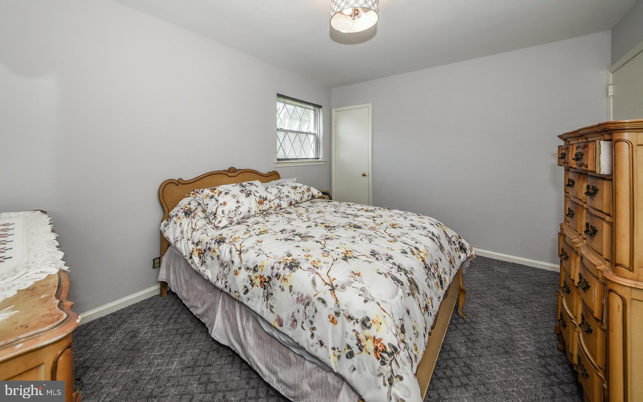 2083 Williamsburg Road Huntingdon Valley, PA 19006 - Photo 21 of 46 a bedroom with a bed and wooden floor