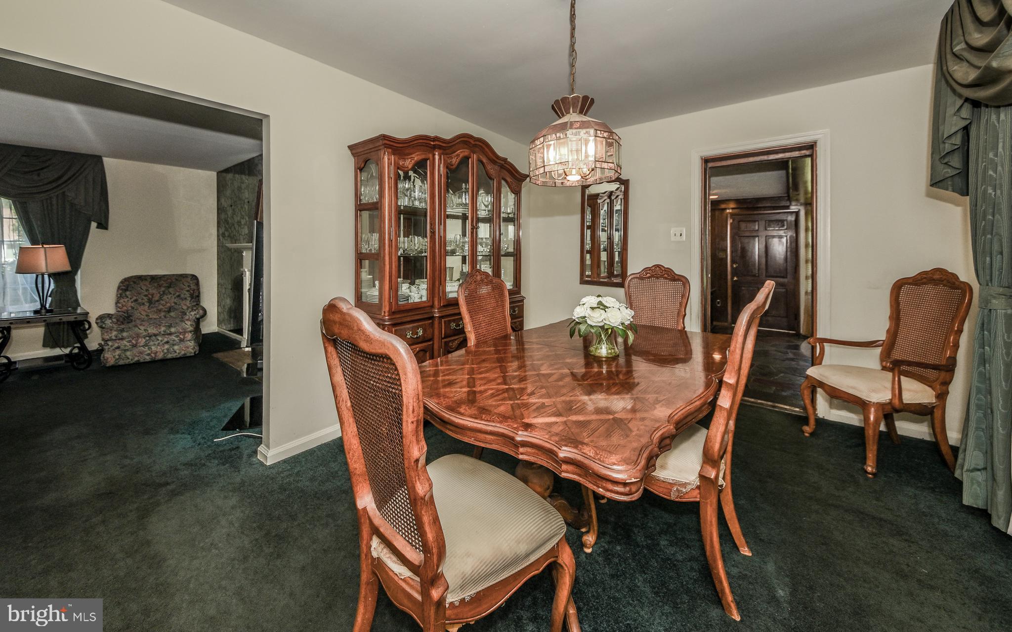 2083 Williamsburg Road Huntingdon Valley, PA 19006 - Photo 5 of 46 a dining room with furniture a chandelier and wooden floor