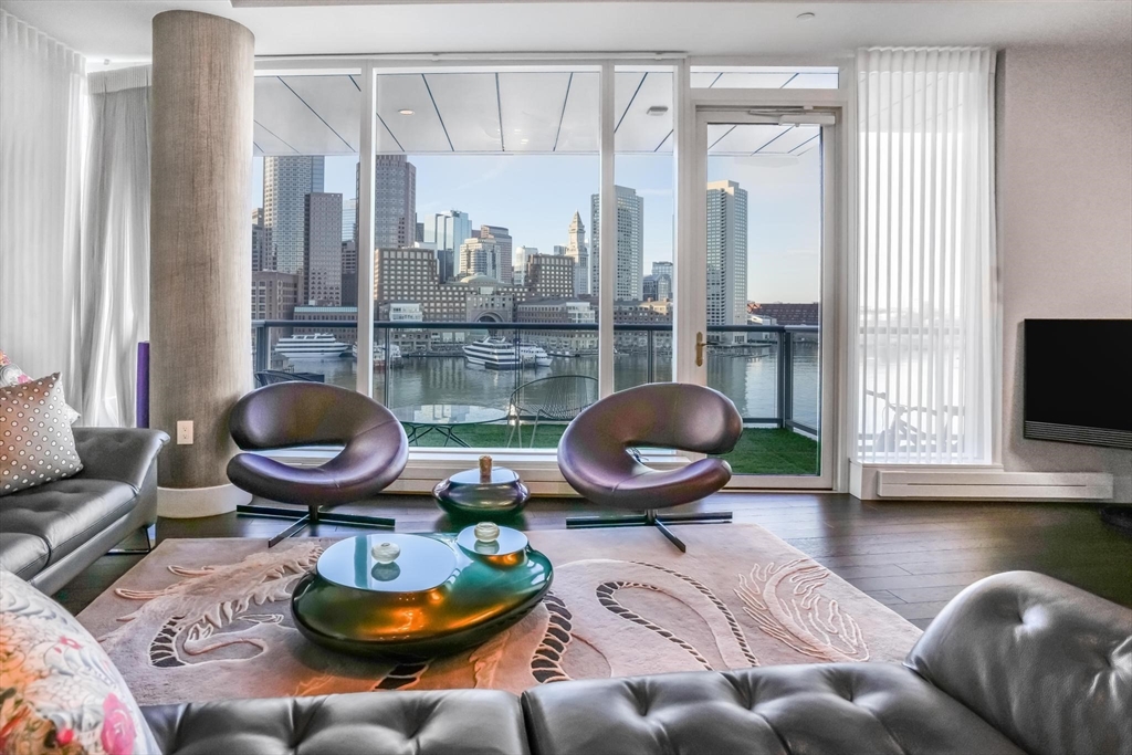 22 Liberty Drive, Unit 7M Boston, MA 02210 - Photo 2 of 31 a living room with furniture and a fireplace