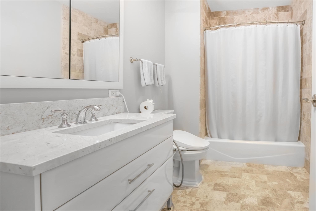 22 Liberty Drive, Unit 7M Boston, MA 02210 - Photo 21 of 31 a bathroom with a sink toilet and shower
