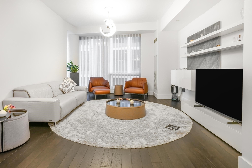 22 Liberty Drive, Unit 7M Boston, MA 02210 - Photo 22 of 31 a living room with furniture and a flat screen tv