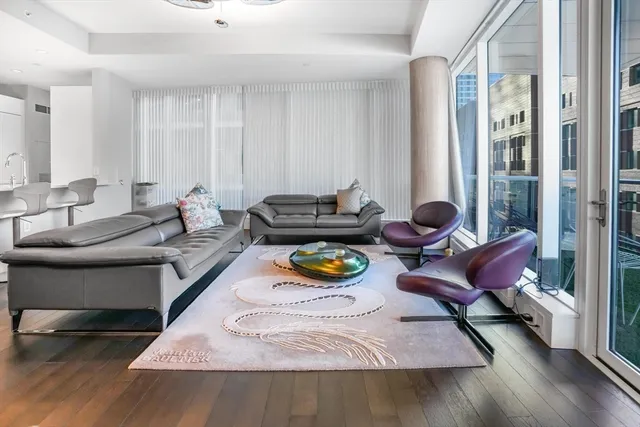 a living room with furniture and a rug