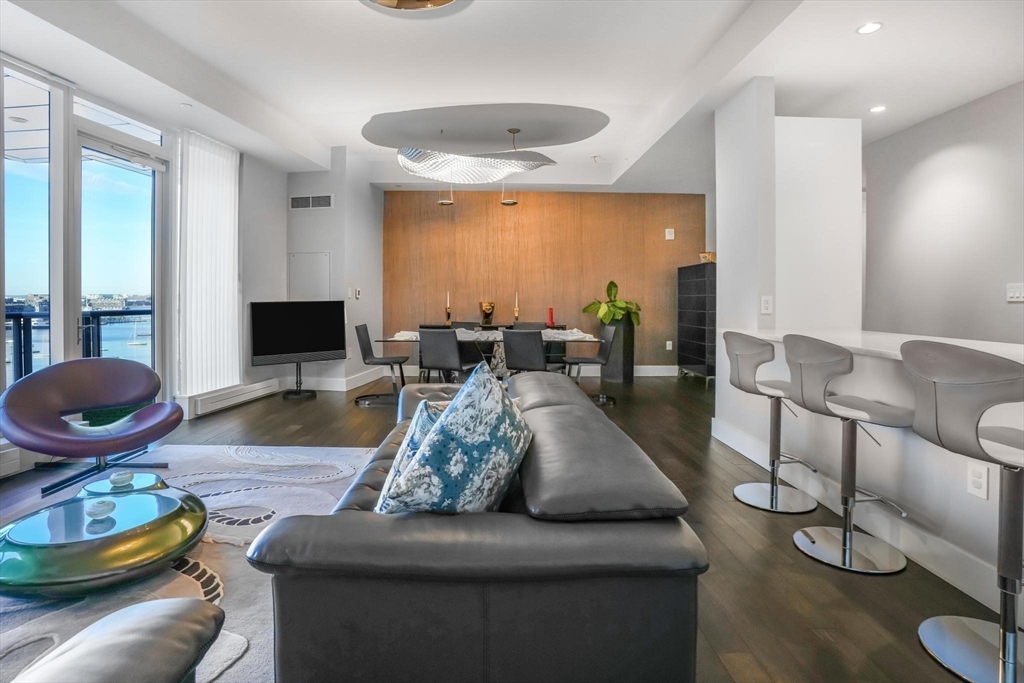 22 Liberty Drive, Unit 7M Boston, MA 02210 - Photo 6 of 31 a living room with furniture and a wooden floor