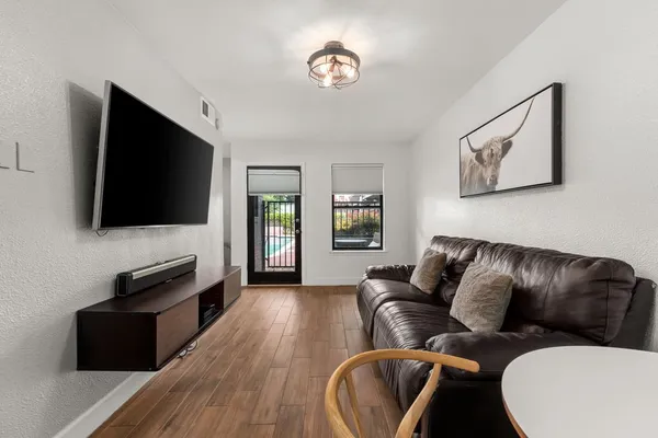 a living room with furniture and a flat screen tv