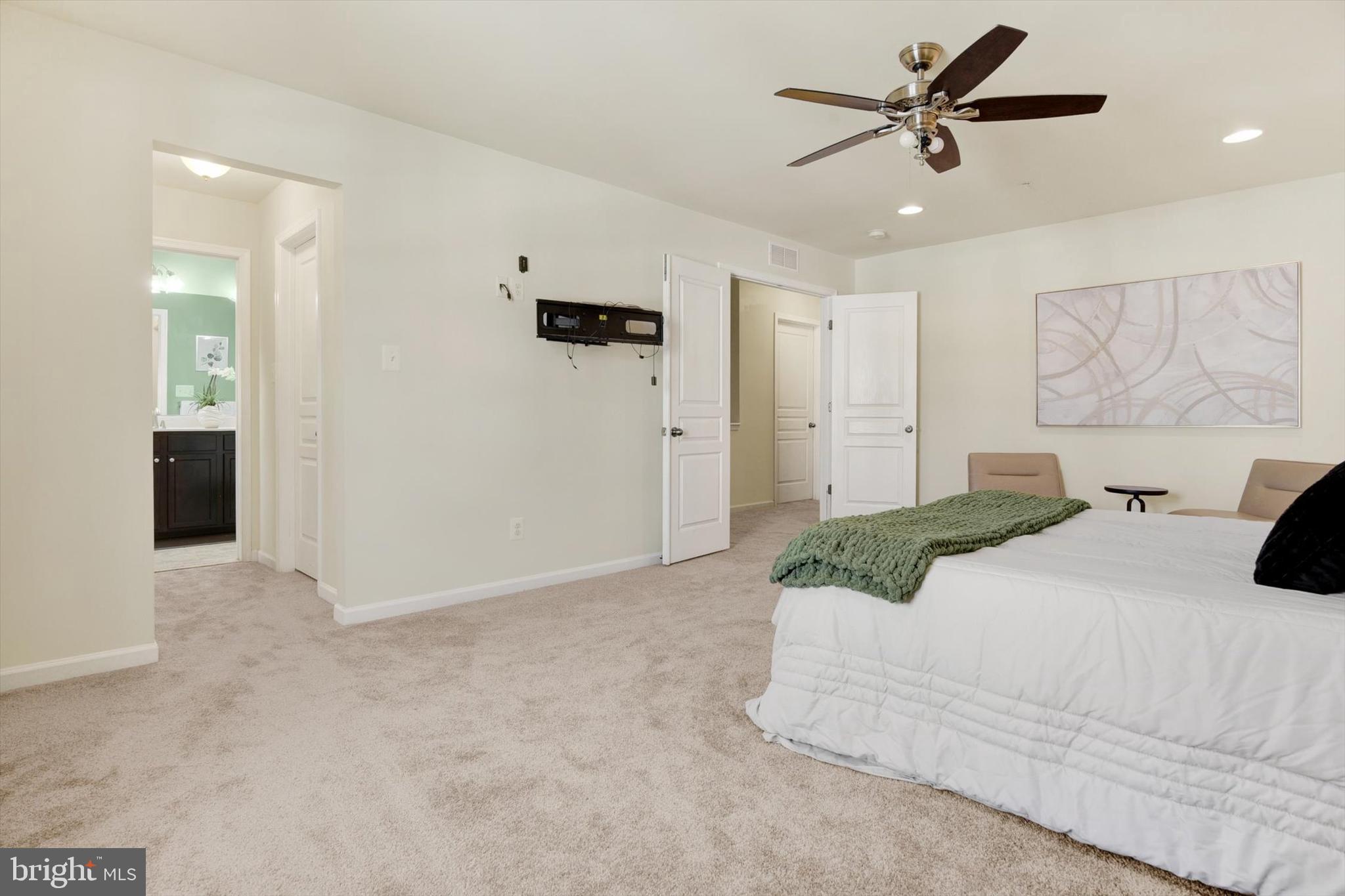 637 Bentgrass Drive Aberdeen, MD 21001 - Photo 14 of 35 a bed room with a bed and a ceiling fan