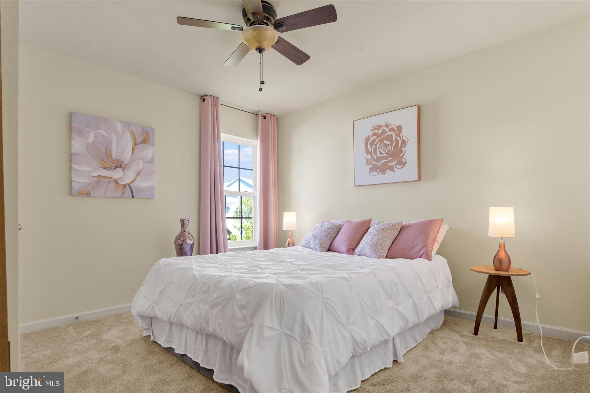 637 Bentgrass Drive Aberdeen, MD 21001 - Photo 18 of 35 a bedroom with a bed and a chandelier