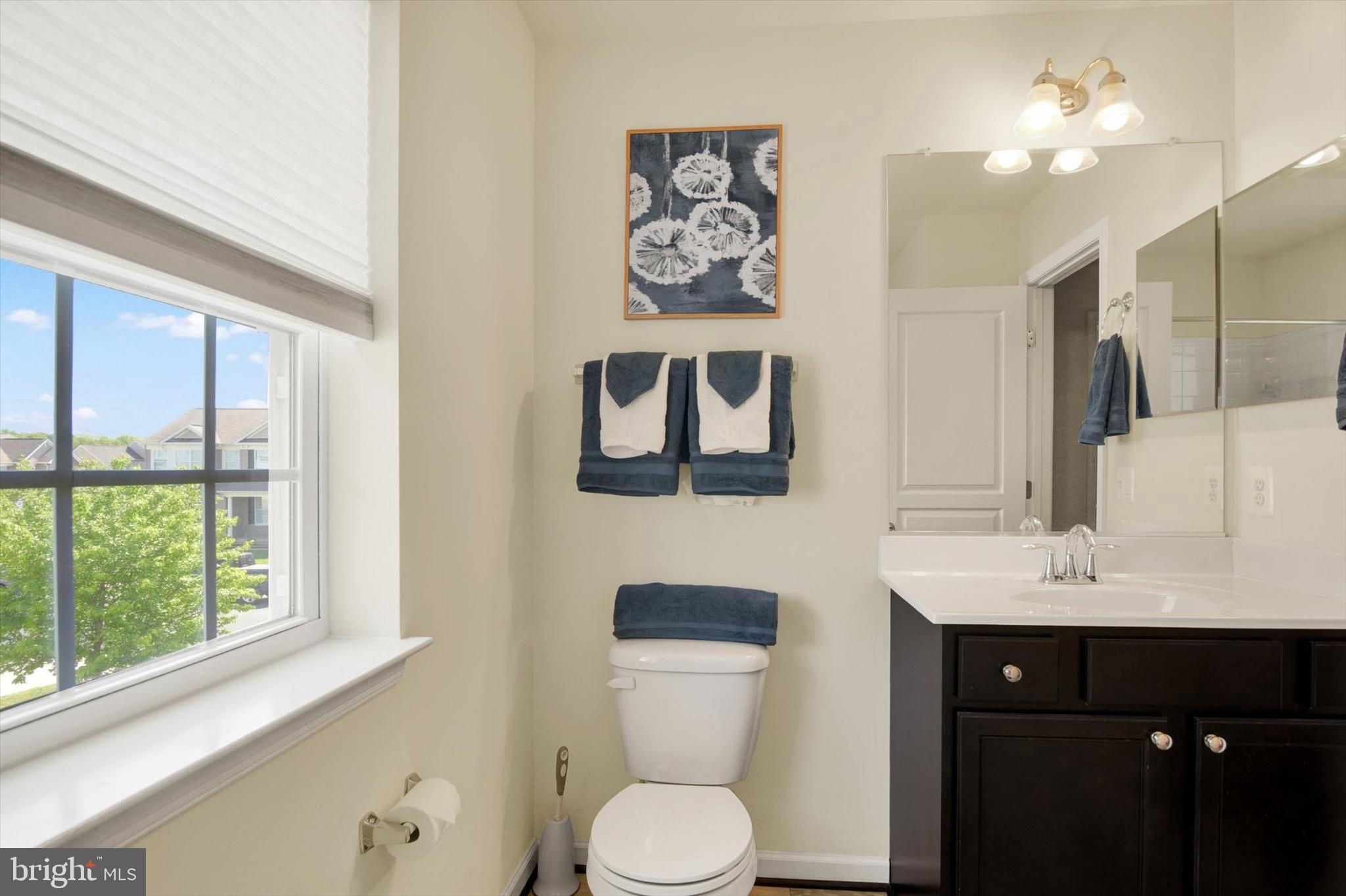 637 Bentgrass Drive Aberdeen, MD 21001 - Photo 22 of 35 a bathroom with a toilet sink and mirror