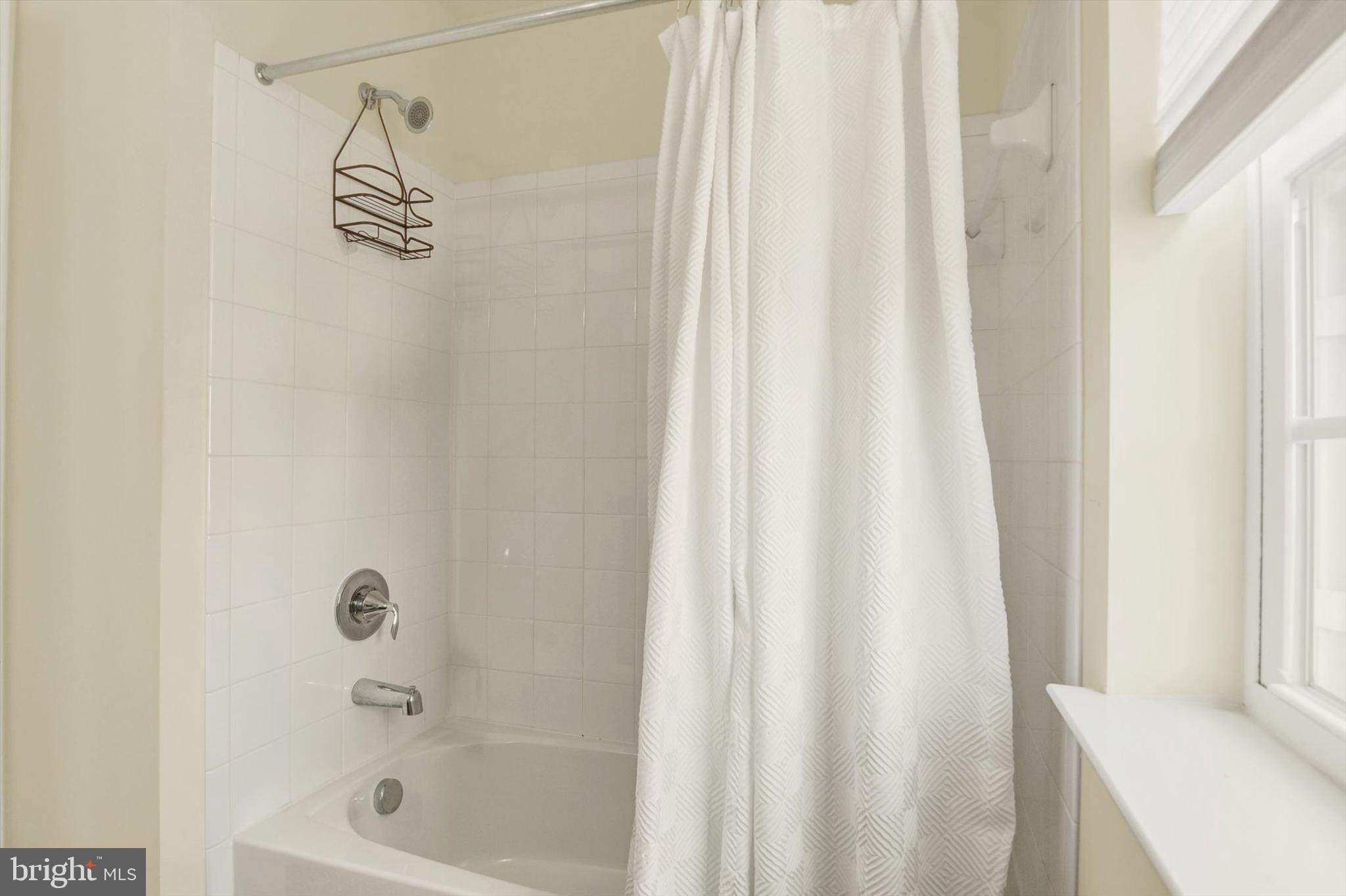 637 Bentgrass Drive Aberdeen, MD 21001 - Photo 23 of 35 a bathroom with a shower curtain and a shower curtain