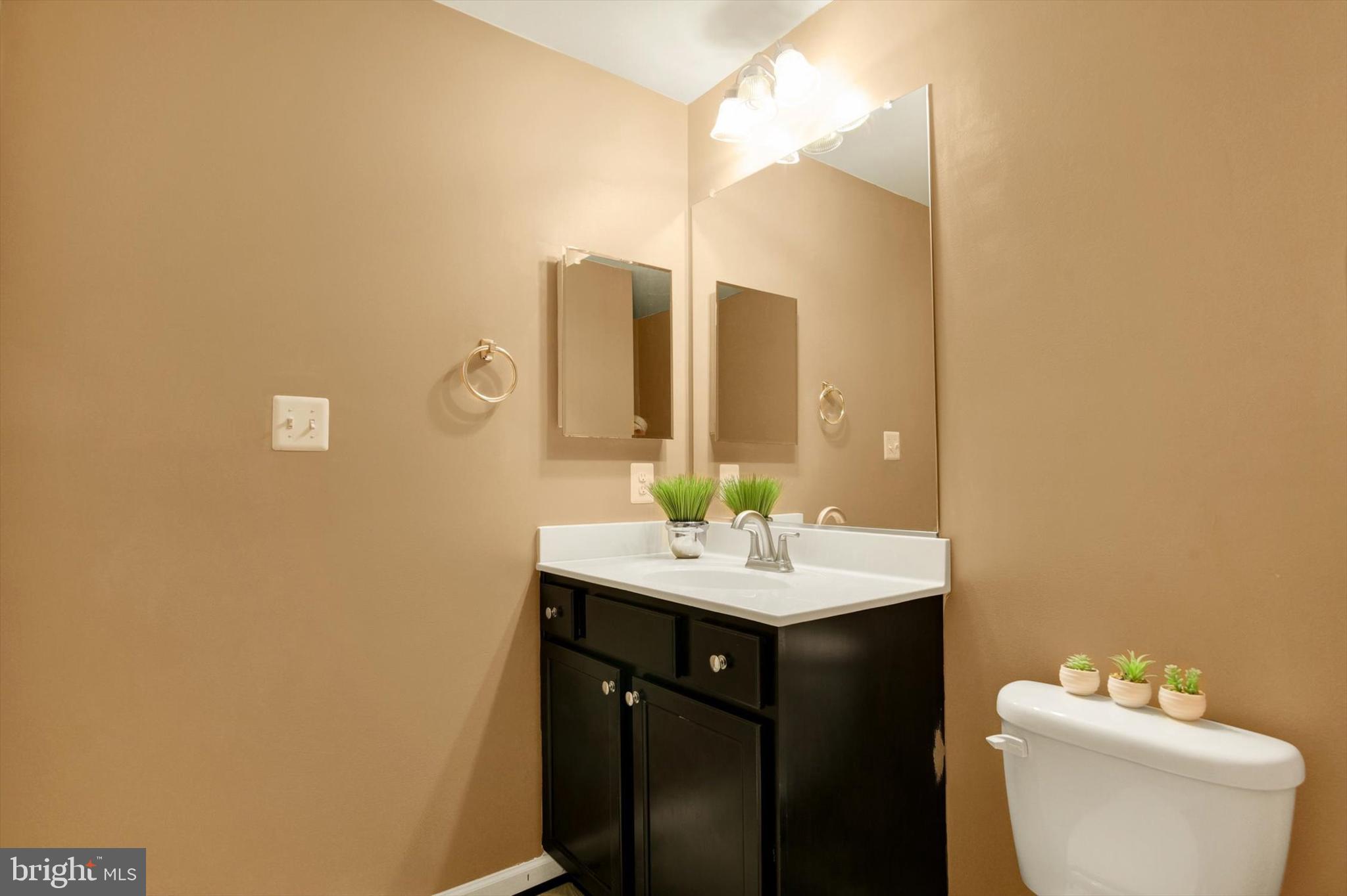 637 Bentgrass Drive Aberdeen, MD 21001 - Photo 26 of 35 a bathroom with a sink mirror and toilet