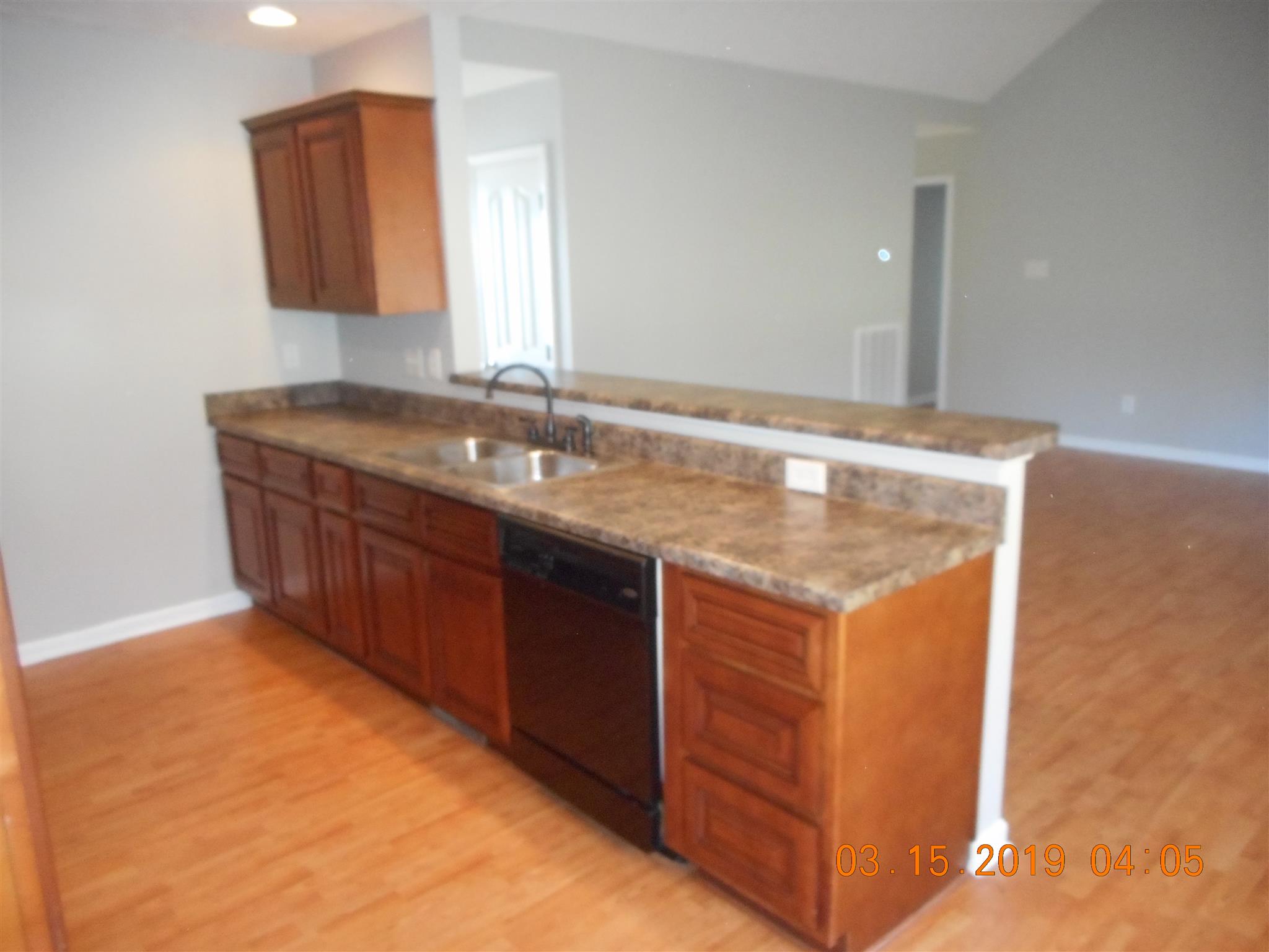Enjoy your company with this open feel viewing your living room from kitchen. 